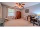 Cozy bedroom with neutral carpet, natural light, and functional furnishings for a comfortable living space at 284 Zion Wood Rd, Loganville, GA 30052