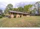 A single-story home with traditional siding and a well-maintained lawn at 284 Zion Wood Rd, Loganville, GA 30052
