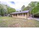 Well-kept home with a manicured lawn and convenient carport at 284 Zion Wood Rd, Loganville, GA 30052