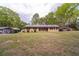 Inviting single-story home with a well-maintained lawn and convenient carports at 284 Zion Wood Rd, Loganville, GA 30052