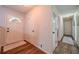 Bright hallway with wood-look floors, white doors, and natural light, creating a clean and open feel at 284 Zion Wood Rd, Loganville, GA 30052