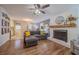 Spacious living room with a fireplace, sectional sofa, and seamless flow to the dining area and kitchen at 284 Zion Wood Rd, Loganville, GA 30052