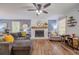 Inviting living room featuring a cozy fireplace, hardwood floors, and stylish decor at 284 Zion Wood Rd, Loganville, GA 30052