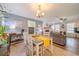 Charming living room with a gray sofa, fireplace, and dining area, perfect for relaxing and entertaining at 284 Zion Wood Rd, Loganville, GA 30052