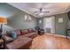 Inviting living room with a comfortable sectional sofa, hardwood floors, and natural light from the window at 284 Zion Wood Rd, Loganville, GA 30052