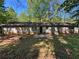 Large backyard with green space and a concrete patio area at 3347 Sir Lancelot Sw Pl, Marietta, GA 30008