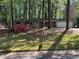 Charming single-story home with flowering shrubs and a two-car garage at 3347 Sir Lancelot Sw Pl, Marietta, GA 30008