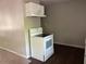 Bright kitchen with white appliances and a stove with an overhead vent at 3347 Sir Lancelot Sw Pl, Marietta, GA 30008