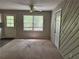 Cozy living area featuring neutral carpet and a view to the yard at 3347 Sir Lancelot Sw Pl, Marietta, GA 30008