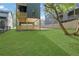 A lovely backyard showcases a covered patio and lush green lawn at 644 Glendale Rd, Scottdale, GA 30079