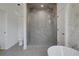 Bathroom features a tiled walk-in shower with dual shower heads and a soaking tub at 644 Glendale Rd, Scottdale, GA 30079