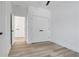 Bright bedroom with hardwood floors and a double-door closet provides storage space at 644 Glendale Rd, Scottdale, GA 30079