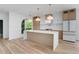 Bright and spacious kitchen featuring quartz countertops, stainless steel appliances, and light wood cabinetry at 644 Glendale Rd, Scottdale, GA 30079