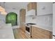 Modern kitchen featuring stainless steel appliances, wood cabinets, and quartz countertops at 644 Glendale Rd, Scottdale, GA 30079