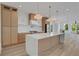 Spacious kitchen with stainless steel appliances, quartz countertops, and light wood cabinets at 644 Glendale Rd, Scottdale, GA 30079