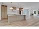 Modern kitchen with island cooktop, marble backsplash, and open layout perfect for entertaining at 644 Glendale Rd, Scottdale, GA 30079