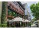 Charming restaurant exterior with outdoor seating under umbrellas at 644 Glendale Rd, Scottdale, GA 30079