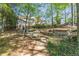 Lush backyard with pond, rock path and mature trees at 860 Cramac Dr, Lawrenceville, GA 30046