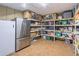 Basement with refrigerator and shelved storage at 860 Cramac Dr, Lawrenceville, GA 30046