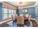 Cozy dining room with a chandelier, wood table, and custom window treatments at 860 Cramac Dr, Lawrenceville, GA 30046