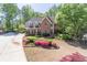 Beautiful two-story brick home with lush landscaping and a well-manicured lawn at 860 Cramac Dr, Lawrenceville, GA 30046