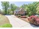 Elegant brick home with a long driveway and colorful landscaping at 860 Cramac Dr, Lawrenceville, GA 30046
