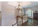 Upstairs landing with hardwood floors, a chandelier and natural light at 860 Cramac Dr, Lawrenceville, GA 30046