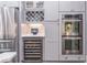 A gourmet kitchen featuring stainless steel appliances including double ovens and a wine fridge at 860 Cramac Dr, Lawrenceville, GA 30046