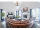 Bright living room featuring vaulted ceiling, fireplace, and hardwood flooring at 860 Cramac Dr, Lawrenceville, GA 30046