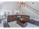 Spacious living room features a staircase, hardwood floors, and leather furniture at 860 Cramac Dr, Lawrenceville, GA 30046