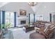 Open-concept living area showcasing a fireplace, large windows, and comfortable seating at 860 Cramac Dr, Lawrenceville, GA 30046