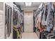This is a walk-in closet complete with plenty of hanging space and a storage tower at 860 Cramac Dr, Lawrenceville, GA 30046