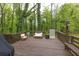 Outdoor deck offers a scenic view and cozy seating area at 1972 Tanglewood Dr, Snellville, GA 30078