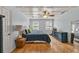Spacious bedroom with hardwood floors, coffered ceiling, and neutral decor at 1972 Tanglewood Dr, Snellville, GA 30078