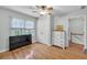 Bright bedroom with natural light, hardwood floors, and closet at 1972 Tanglewood Dr, Snellville, GA 30078
