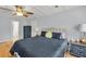 Comfortable bedroom with coffered ceiling, hardwood floors, and neutral accents at 1972 Tanglewood Dr, Snellville, GA 30078