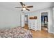 Bright bedroom with hardwood floors, neutral walls, and a walk-in closet at 1972 Tanglewood Dr, Snellville, GA 30078