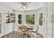 Charming dining area with natural light and views of nature at 1972 Tanglewood Dr, Snellville, GA 30078