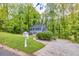 Beautiful blue two-story home with a lush green lawn at 1972 Tanglewood Dr, Snellville, GA 30078