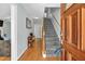 Open foyer featuring wood floors, a staircase, and a view into the living spaces at 1972 Tanglewood Dr, Snellville, GA 30078