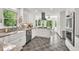 Bright kitchen with granite countertops, stainless steel appliances, custom cabinets, and a center island at 1972 Tanglewood Dr, Snellville, GA 30078