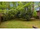 Expansive backyard with beautiful trees and landscaping, offering privacy and tranquility at 2343 Kings Point Dr, Dunwoody, GA 30338