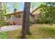 Charming backyard with a patio, brick accents, and mature trees, perfect for relaxation at 2343 Kings Point Dr, Dunwoody, GA 30338