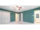 Spacious bedroom with closet doors, ensuite access, and plenty of natural light at 2343 Kings Point Dr, Dunwoody, GA 30338