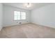 Bright bedroom with a ceiling fan and a window letting in natural light at 2343 Kings Point Dr, Dunwoody, GA 30338