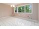 Inviting dining area with views of the backyard through a large window at 2343 Kings Point Dr, Dunwoody, GA 30338