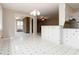 Dining room with views into the living room and kitchen, with tiled floors at 2343 Kings Point Dr, Dunwoody, GA 30338