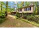 Charming two-story home with well-maintained lawn and beautiful landscaping at 2343 Kings Point Dr, Dunwoody, GA 30338