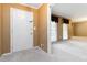 Inviting foyer featuring neutral walls and carpeting and natural light from the adjacent living room at 2343 Kings Point Dr, Dunwoody, GA 30338
