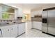 Modern kitchen featuring stainless steel appliances and ample counter space at 2343 Kings Point Dr, Dunwoody, GA 30338